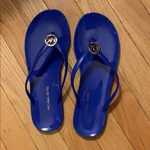 blue Michael Kors flip flops